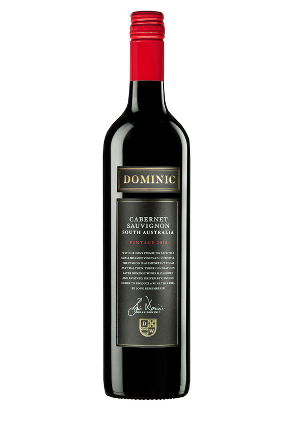 Black wine bottle with red cap and black label