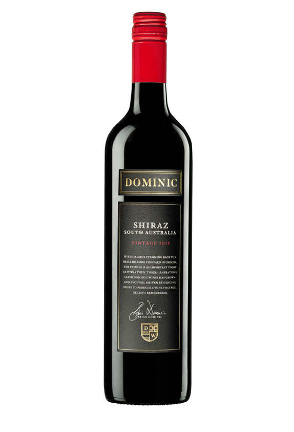 Black wine bottle with red cap and black label